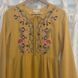Beautiful mustard yellow maxi dress with colorful floral embroidery.